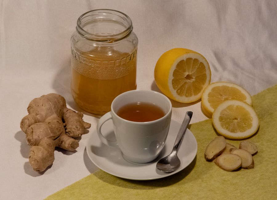 A cozy setup featuring ginger lemon tea with honey, promoting wellness and comfort.
