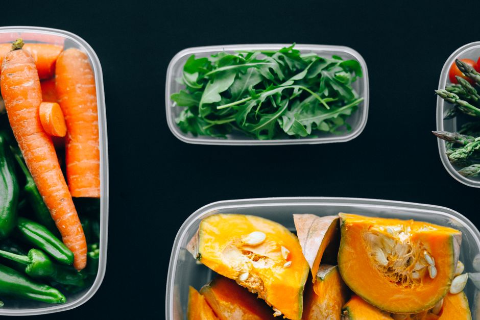 Healthy vegetables stored in plastic containers for fresh and nutritious meals.