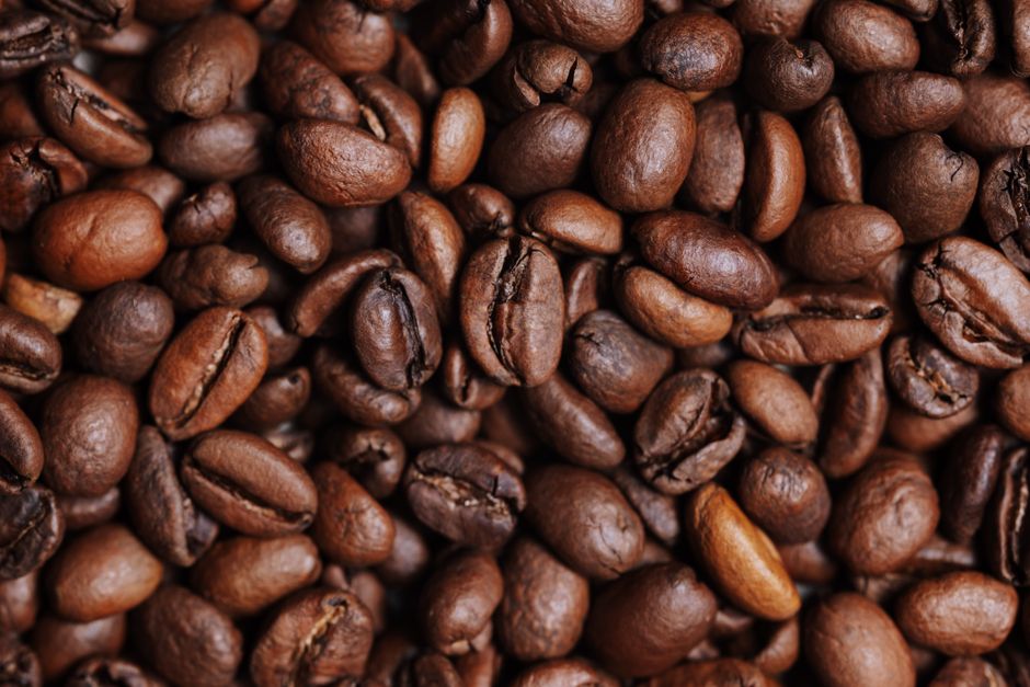 A detailed close-up of roasted coffee beans showcasing texture and color.