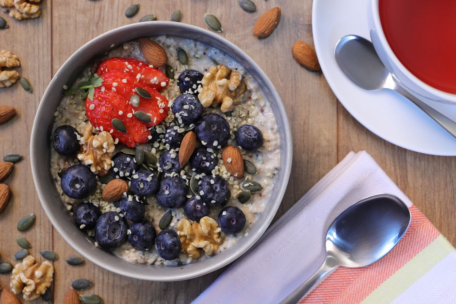 A nutritious breakfast bowl featuring strawberries, blueberries, almonds, and walnuts. Ideal for a healthy start.