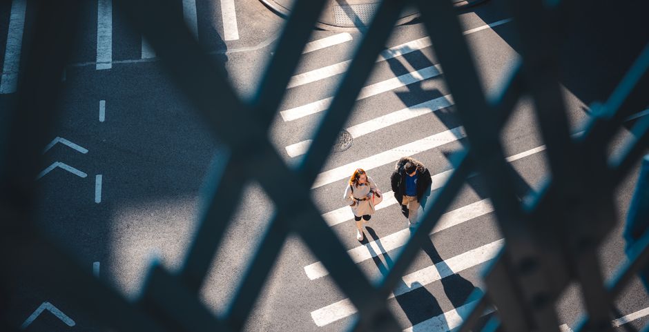 Aerial view of pedestrians crossing a street in New York City.
