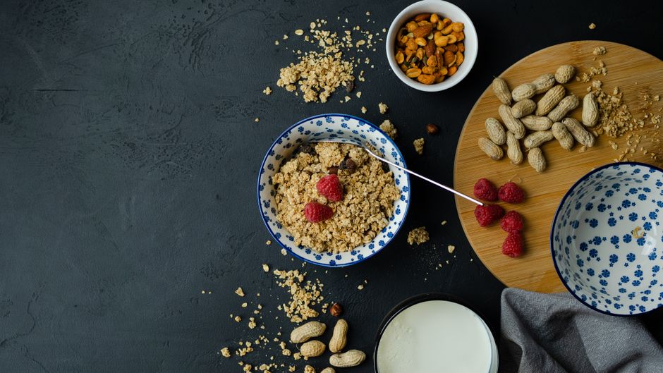 Delicious cereal with raspberries on a tray, ready for a nutritious breakfast.