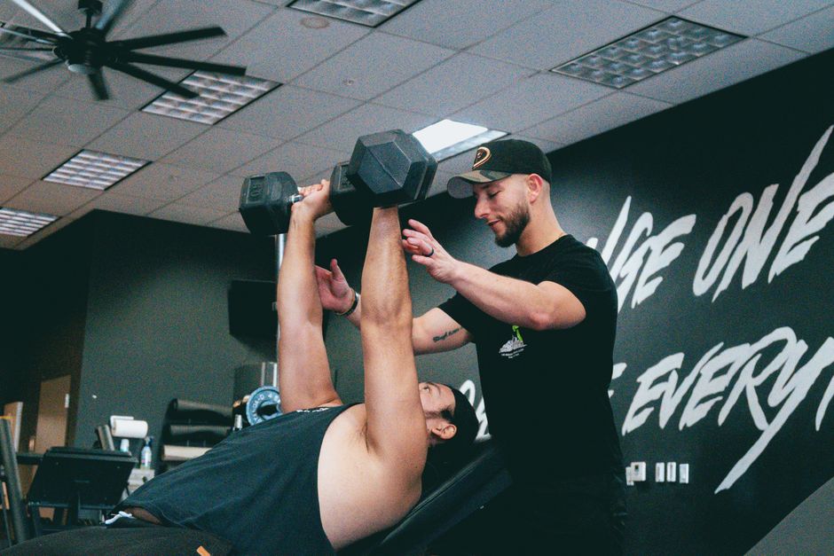 Indoor personal training session focusing on strength training and core workout.