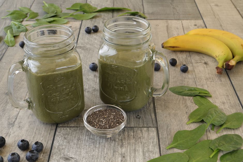 Refreshing green smoothies with spinach, blueberries, and chia seeds for a nutritious boost.