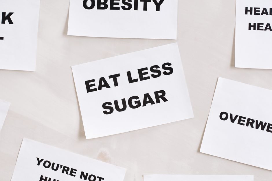Minimalist photograph of motivational cards with healthy lifestyle messages on a white background.